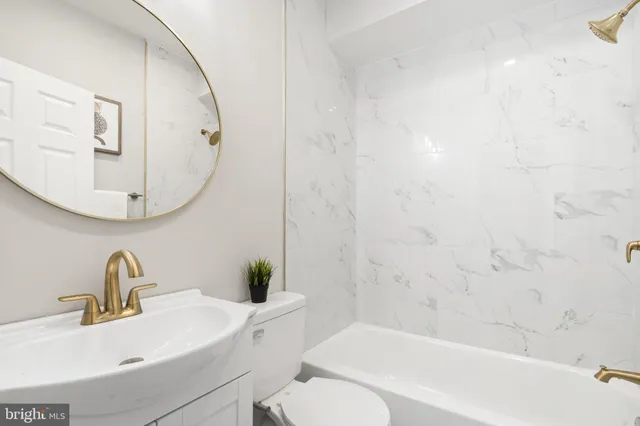 a bathroom with a sink and mirror