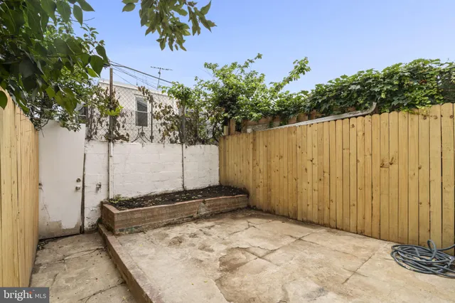 a view of a car parked in front of a building