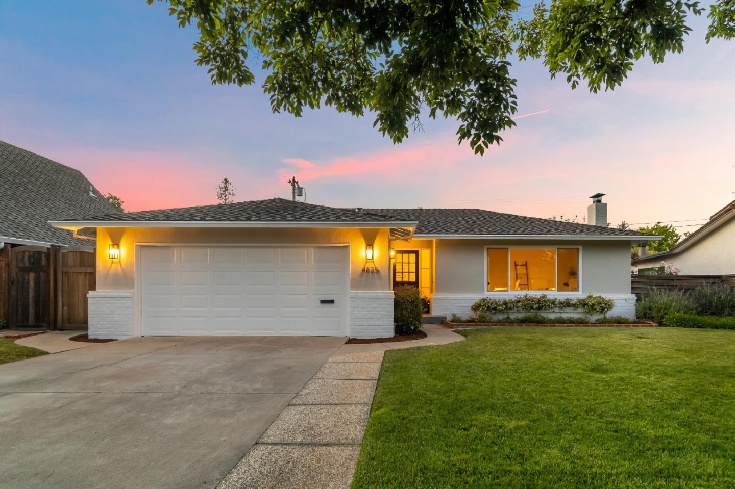 4825 Blue Ridge Drive San Jose, CA 95129 - Photo 1 of 39 a front view of a house with a yard and garage