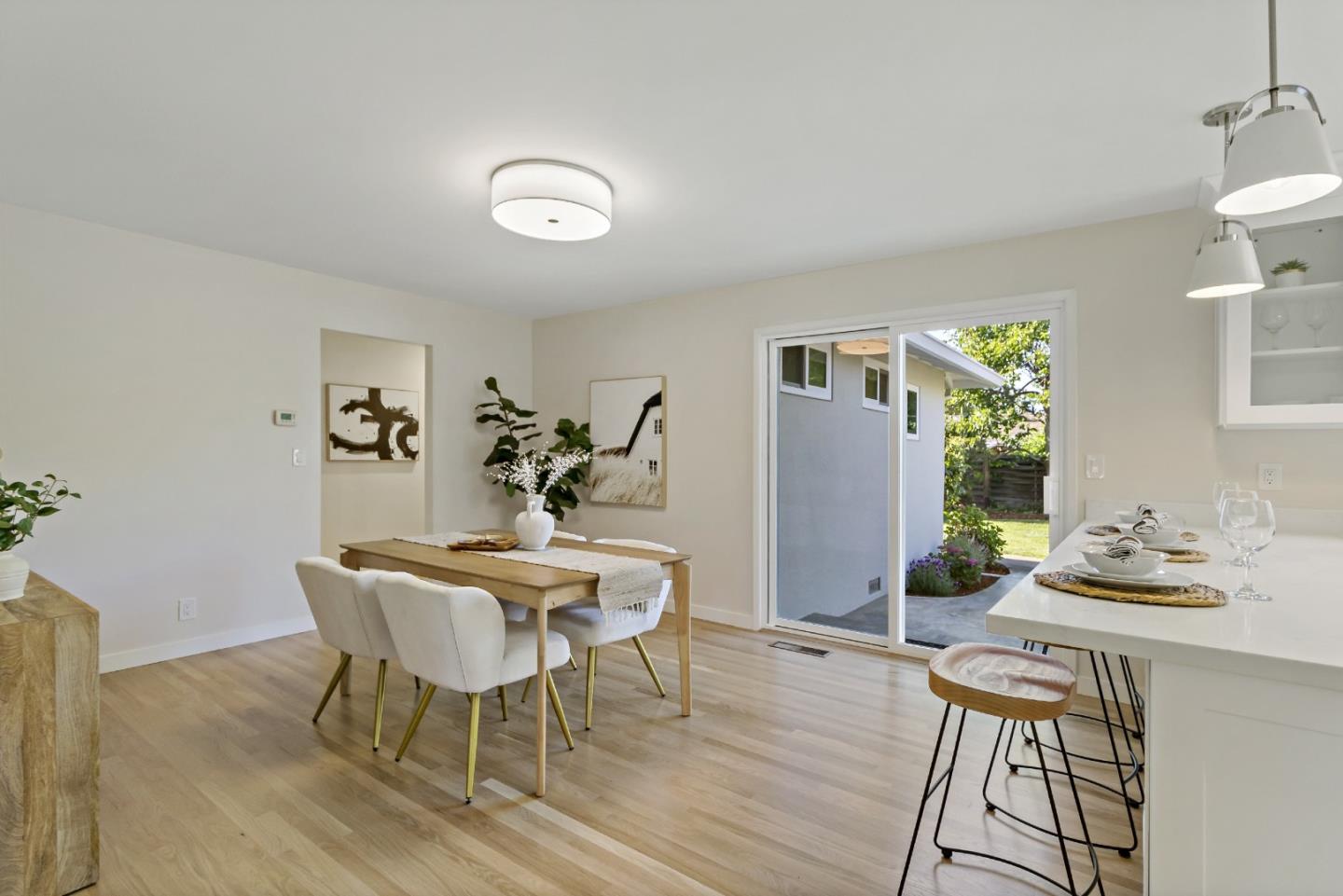 4825 Blue Ridge Drive San Jose, CA 95129 - Photo 11 of 39 a view of a dining room with furniture and wooden floor