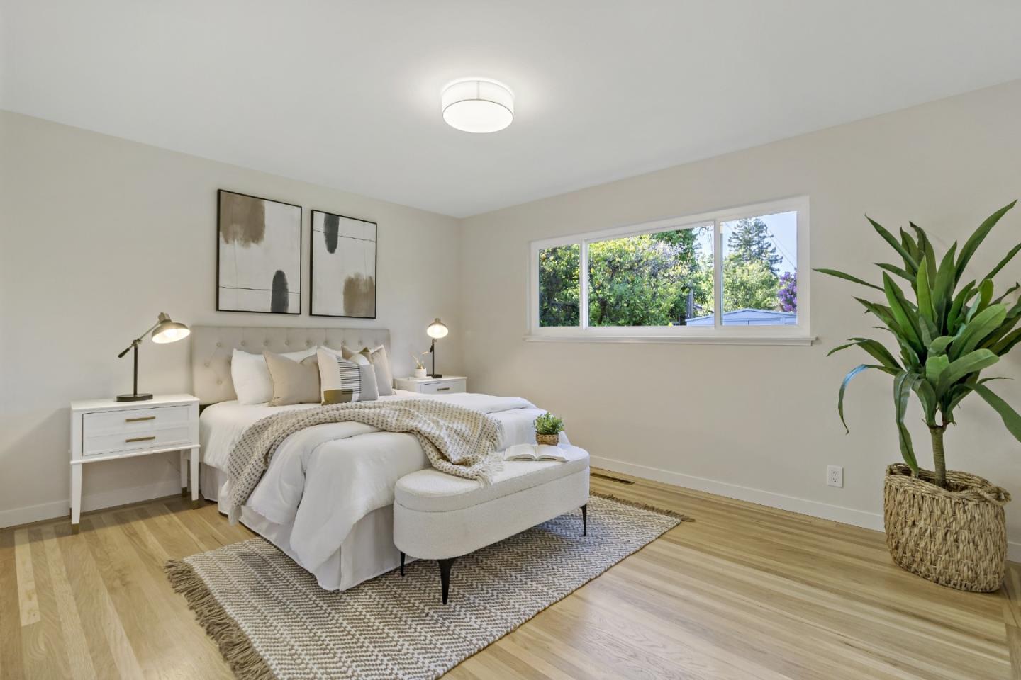 4825 Blue Ridge Drive San Jose, CA 95129 - Photo 14 of 39 a spacious bedroom with a bed and a potted plant