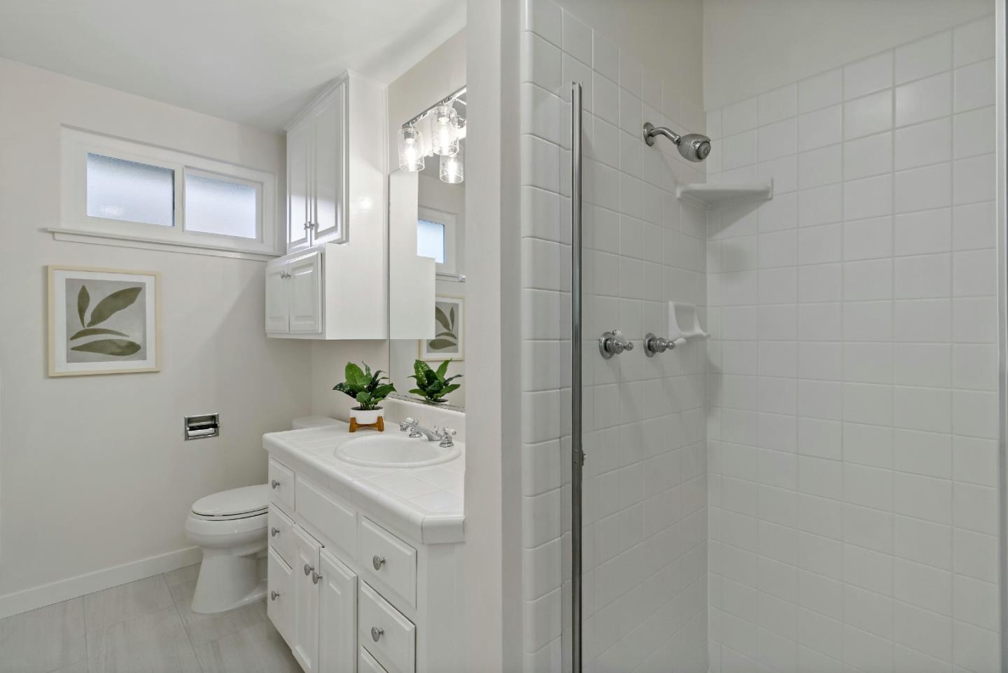 4825 Blue Ridge Drive San Jose, CA 95129 - Photo 18 of 39 a bathroom with a sink toilet and shower