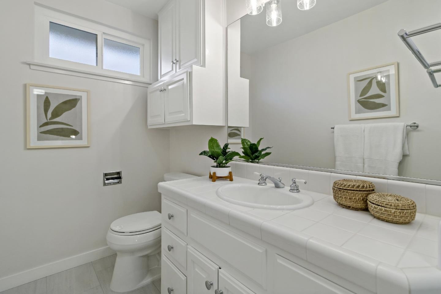 4825 Blue Ridge Drive San Jose, CA 95129 - Photo 19 of 39 a bathroom with a sink a toilet and mirror