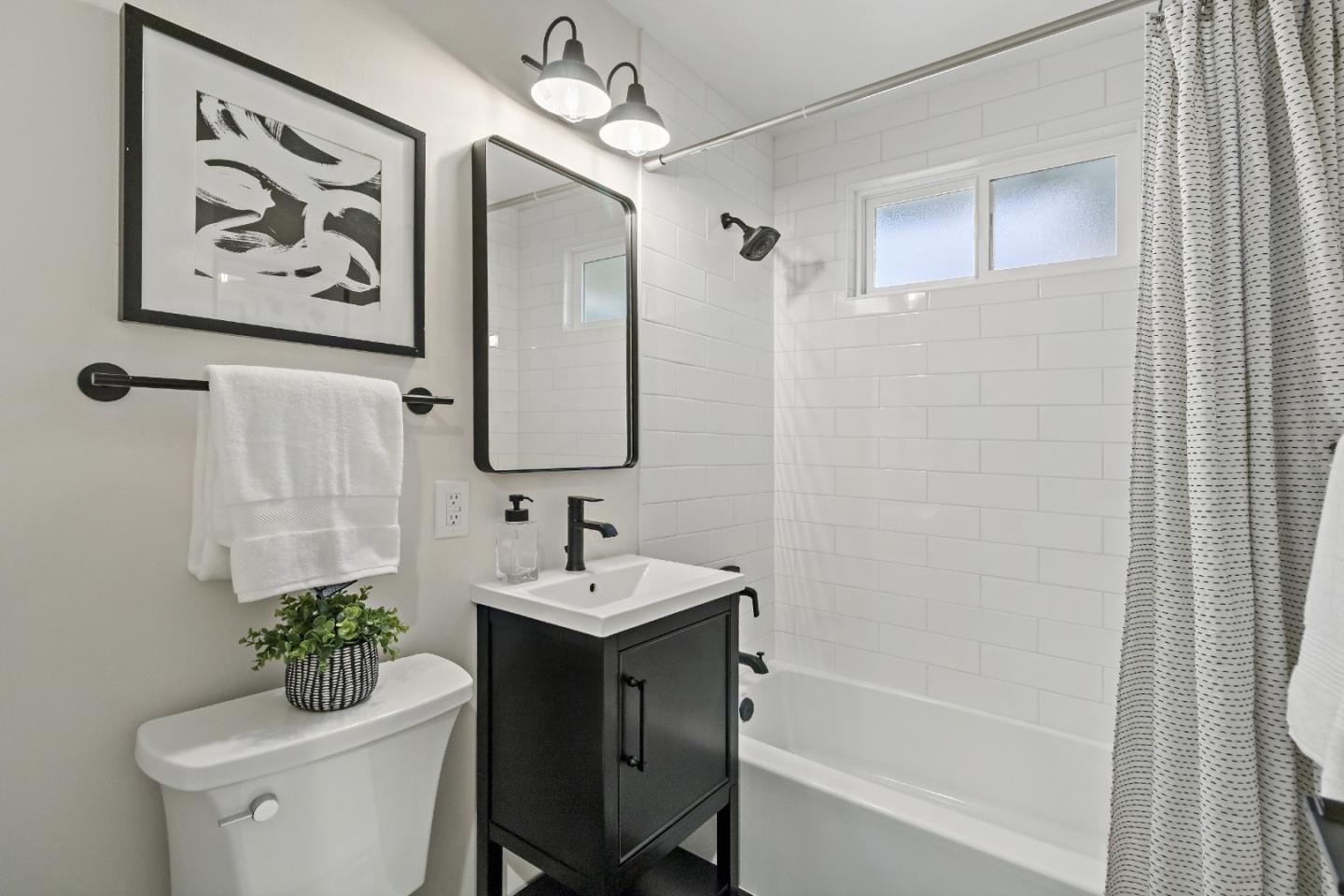 4825 Blue Ridge Drive San Jose, CA 95129 - Photo 23 of 39 a bathroom with a sink a toilet and a bathtub