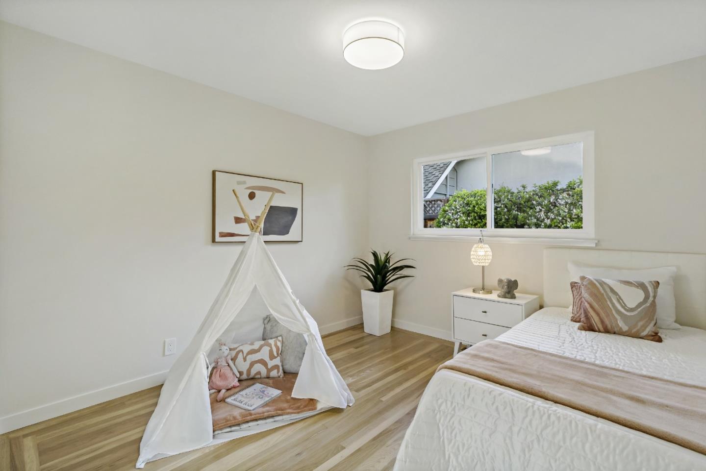 4825 Blue Ridge Drive San Jose, CA 95129 - Photo 24 of 39 a bedroom with a bed and a painting on the wall