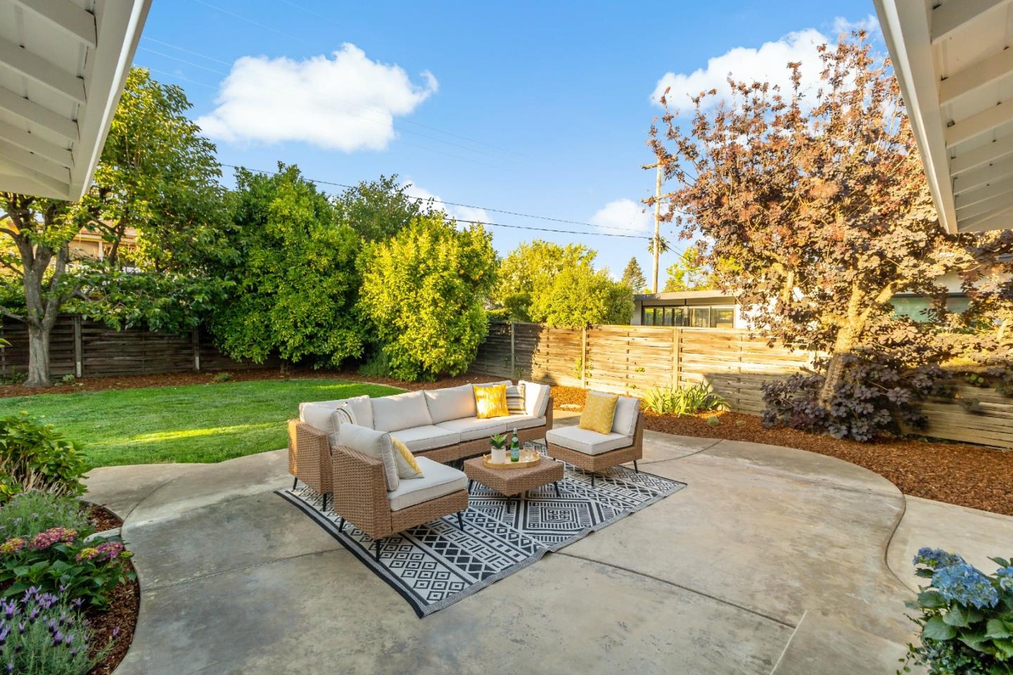 4825 Blue Ridge Drive San Jose, CA 95129 - Photo 26 of 39 a view of a patio with couches table and chairs and garden