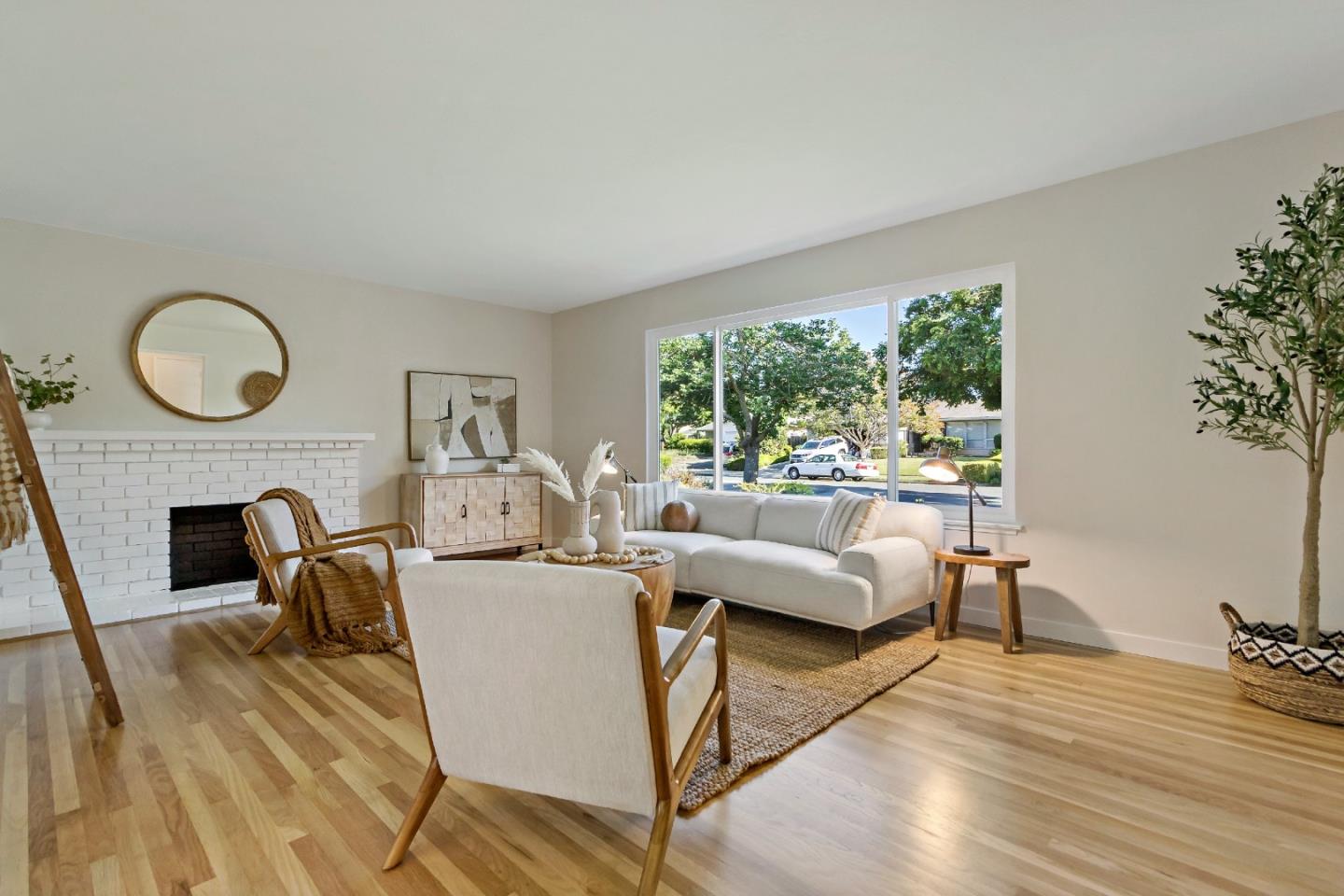 4825 Blue Ridge Drive San Jose, CA 95129 - Photo 4 of 39 a living room with furniture a fireplace and a large window