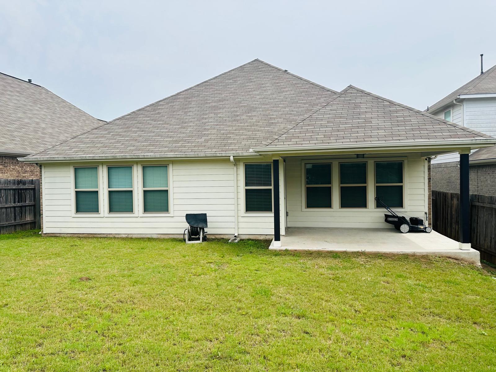 862 Leadtree Loop Buda, TX 78610 - Photo 36 of 40 a house that has a large pool in front of a big yard