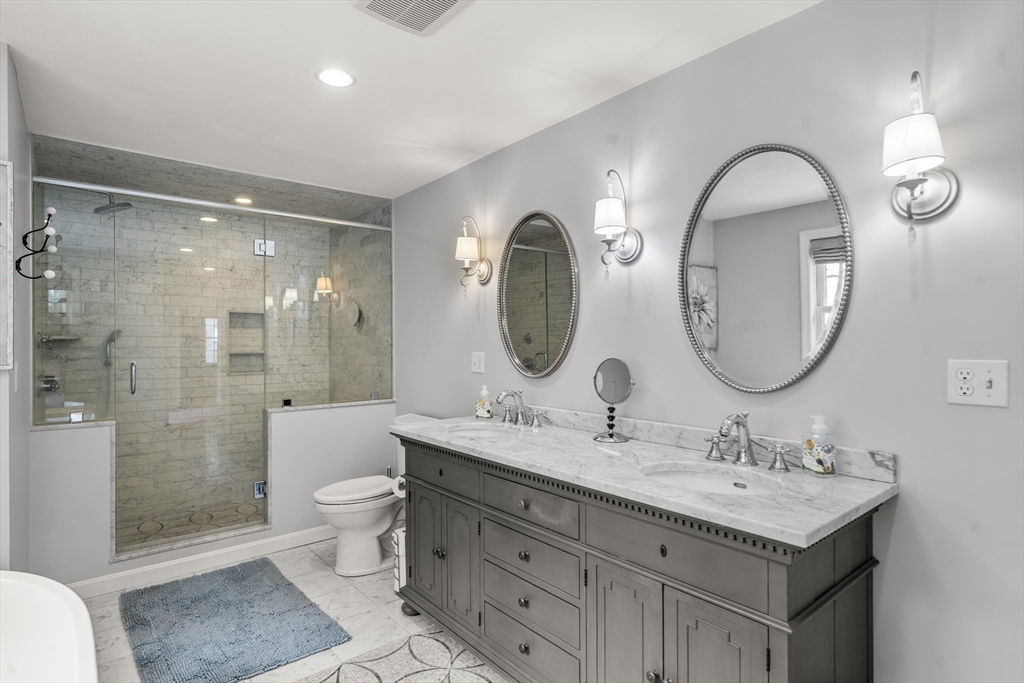 30 Franklin Rodgers Road Hingham, MA 02043 - Photo 28 of 37 a bathroom with a double vanity sink mirror and toilet