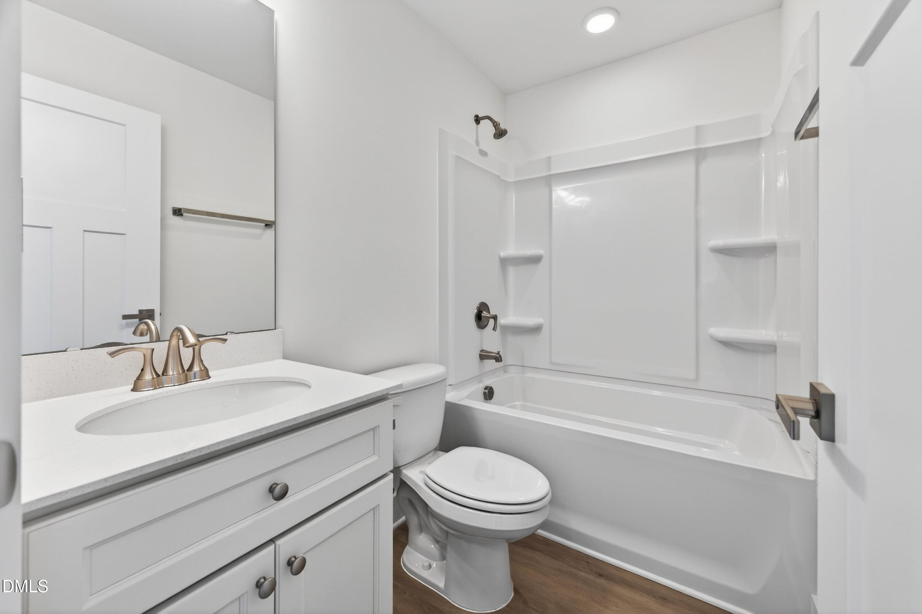 1238 Hurdle Mills Road Roxboro, NC 27573 - Photo 35 of 50 a bathroom with a sink a toilet and a mirror
