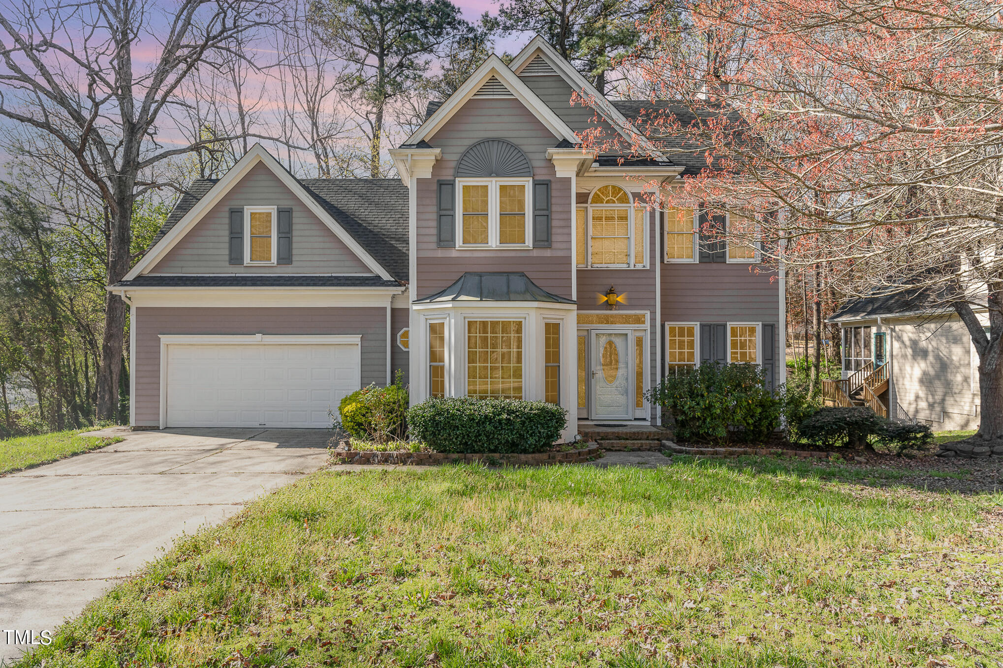 6020 Bur Trail Raleigh, NC 27616 - Photo 1 of 28 a front view of a house with a yard and garage