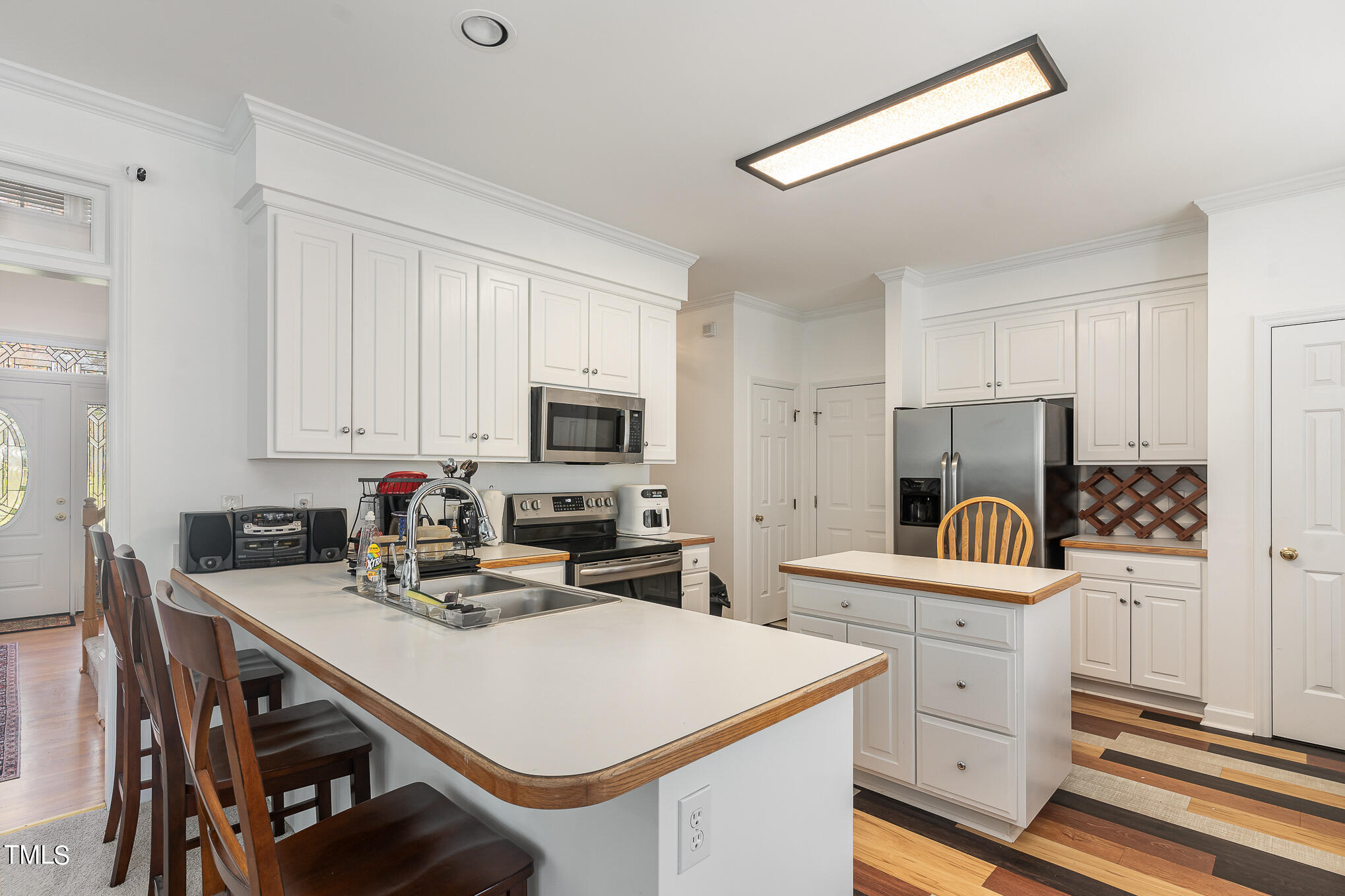 6020 Bur Trail Raleigh, NC 27616 - Photo 11 of 28 a kitchen with appliances a sink and cabinets
