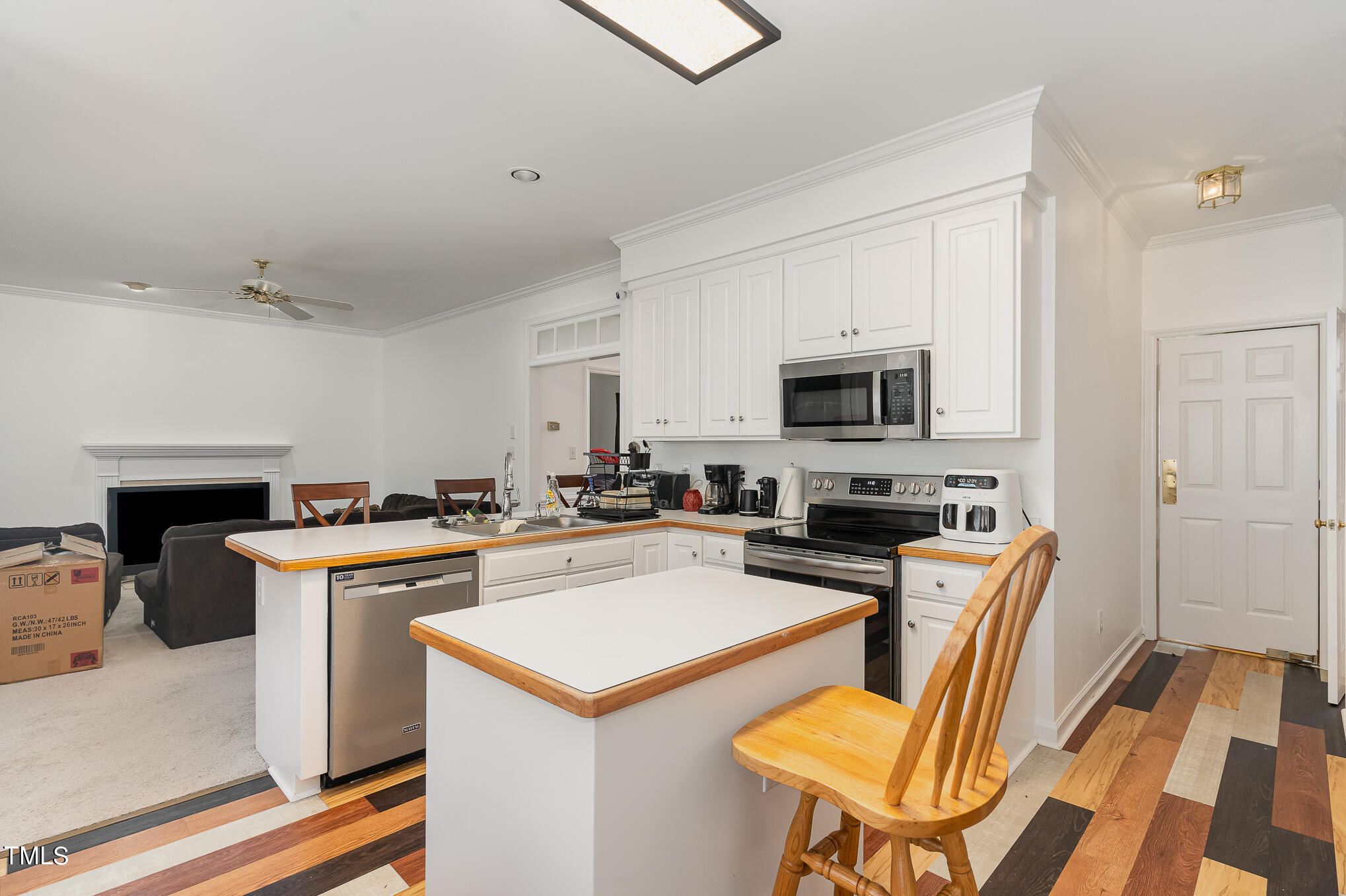 6020 Bur Trail Raleigh, NC 27616 - Photo 12 of 28 a view of a kitchen with furniture and wooden floor