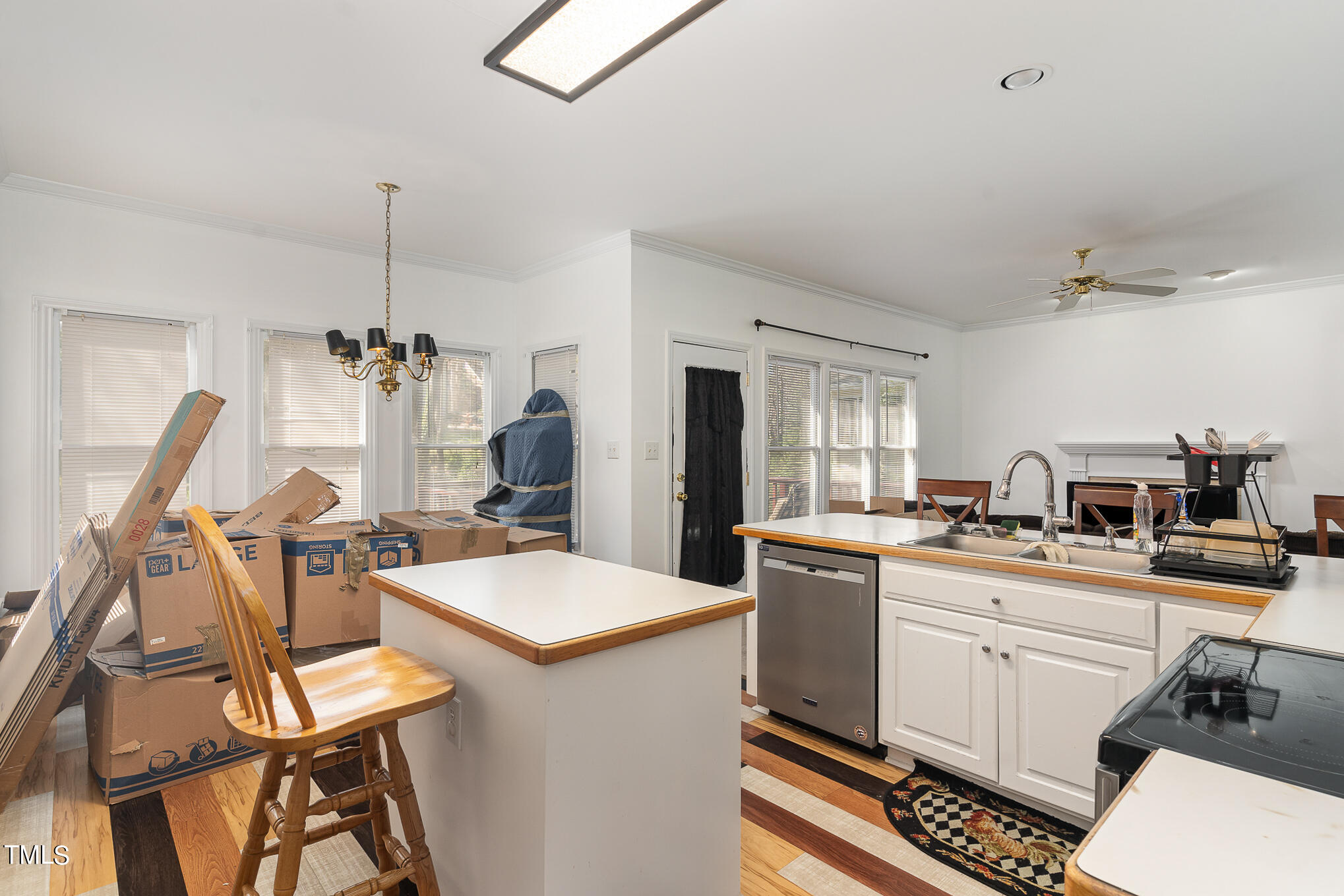 6020 Bur Trail Raleigh, NC 27616 - Photo 13 of 28 a kitchen with a sink stove and cabinets