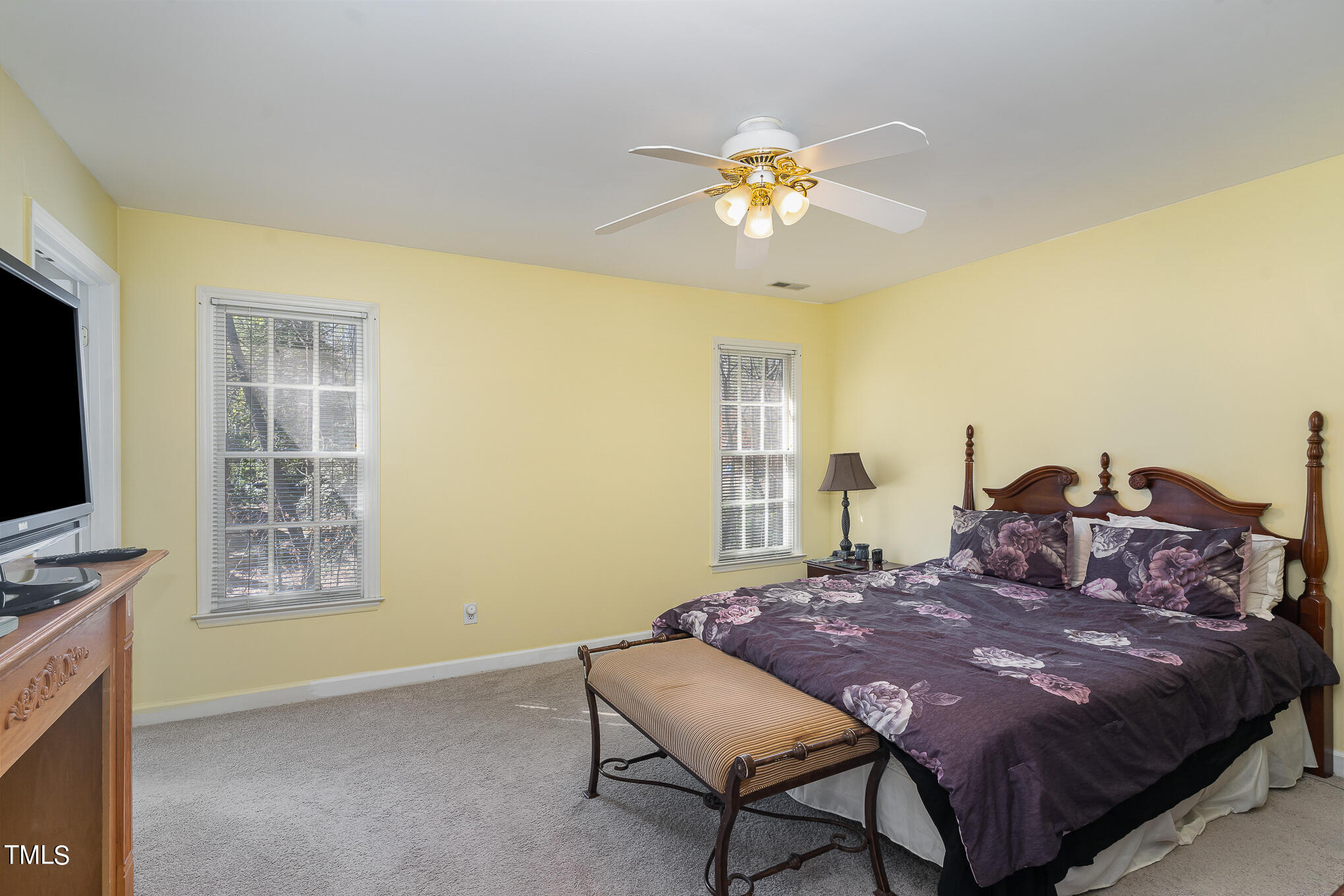 6020 Bur Trail Raleigh, NC 27616 - Photo 15 of 28 a bed sitting in a spacious bedroom next to a window