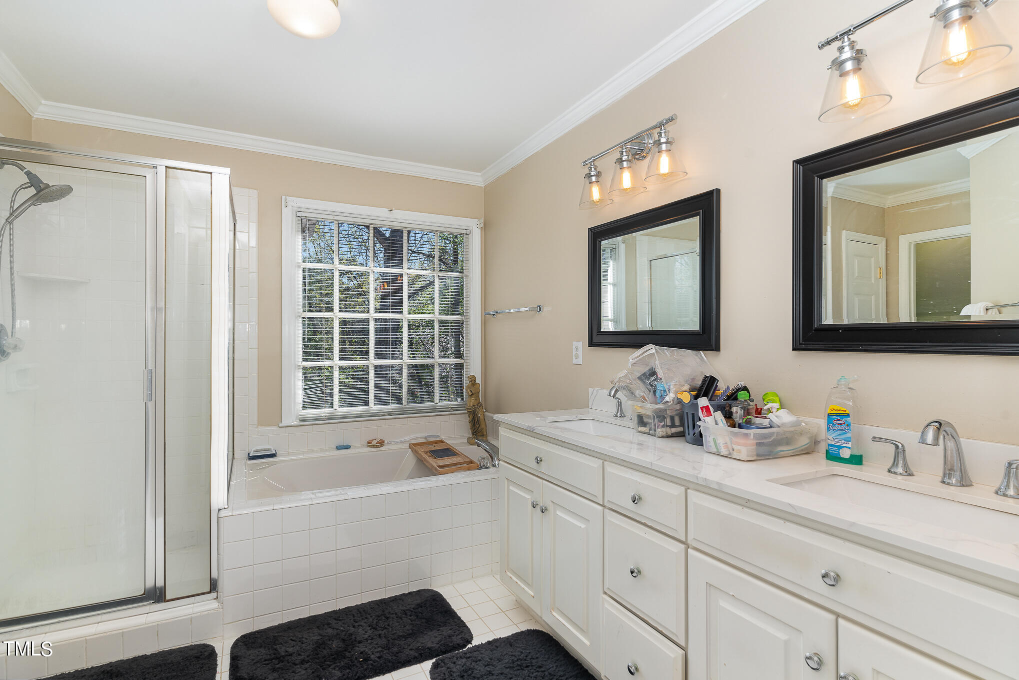 6020 Bur Trail Raleigh, NC 27616 - Photo 17 of 28 a bathroom with a tub a sink and mirror