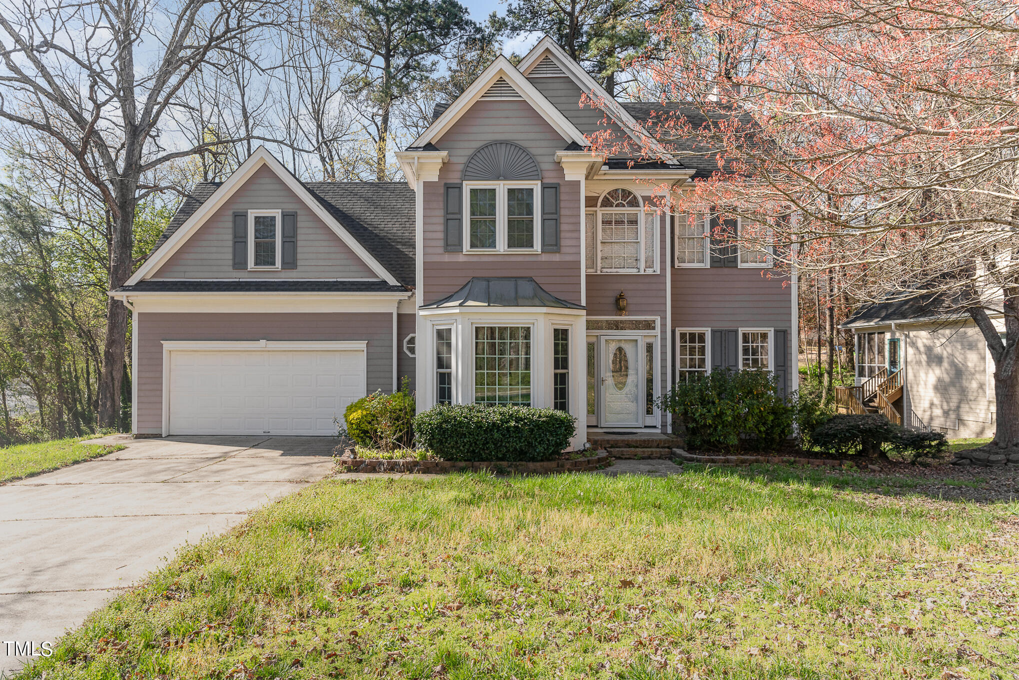 6020 Bur Trail Raleigh, NC 27616 - Photo 2 of 28 a front view of a house with a yard and plants