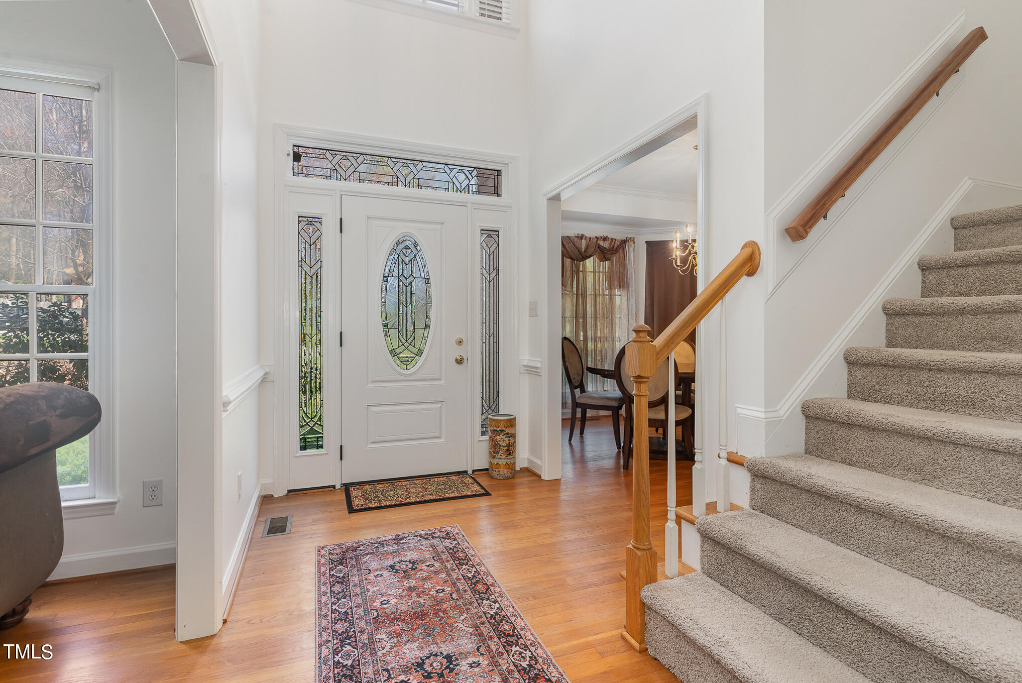 6020 Bur Trail Raleigh, NC 27616 - Photo 6 of 28 a view of entryway and hall with wooden floor