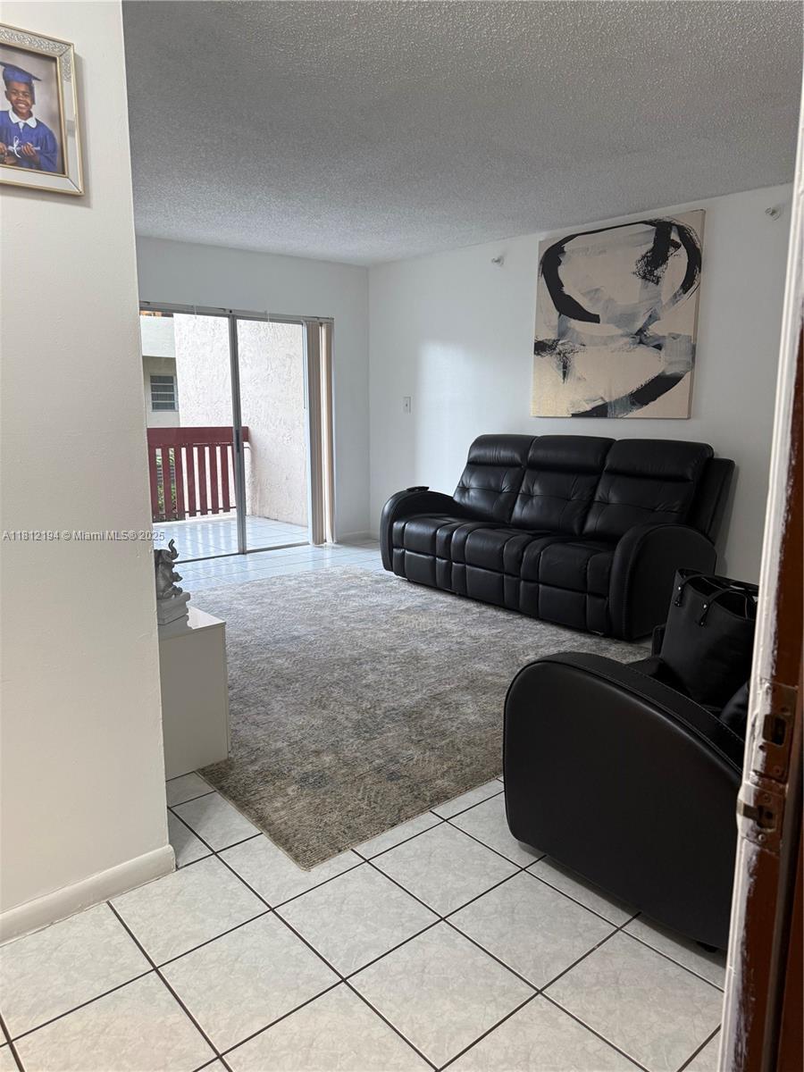 10661 Southwest 108th Avenue, Unit 2E Miami, FL 33176 - Photo 5 of 25 a bedroom with a bed and window