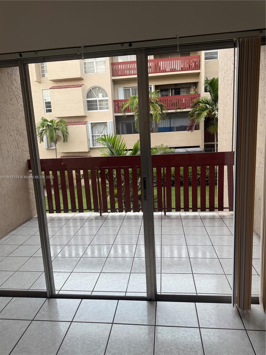 10661 Southwest 108th Avenue, Unit 2E Miami, FL 33176 - Photo 6 of 25 a view of front door
