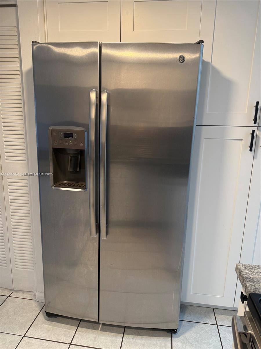 10661 Southwest 108th Avenue, Unit 2E Miami, FL 33176 - Photo 8 of 25 a close view of a refrigerator in kitchen