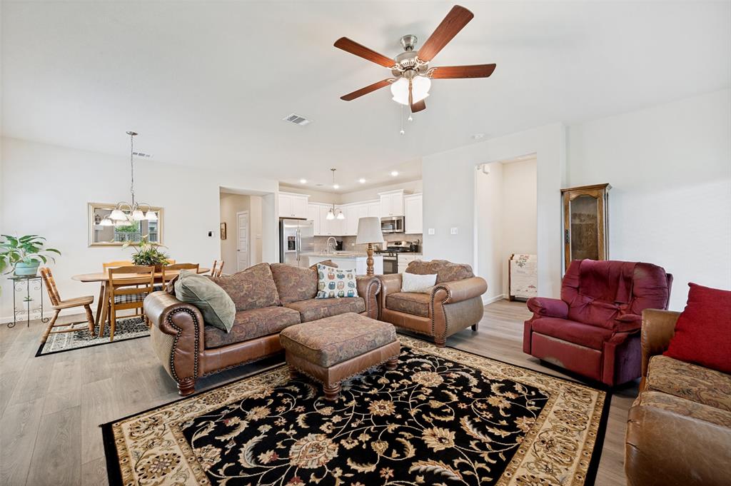 413 Wiggins Way Van Alstyne, TX 75495 - Photo 12 of 25 Spacious living area with wood-finish flooring, ceiling fan, and recessed lighting