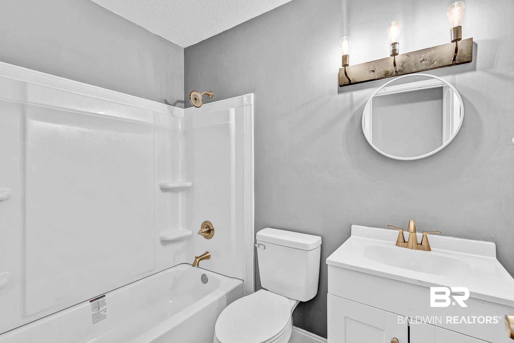 3304 Armond Drive Mobile, AL 36605 - Photo 38 of 62 Full bathroom with vanity, tub / shower combination, and a textured ceiling