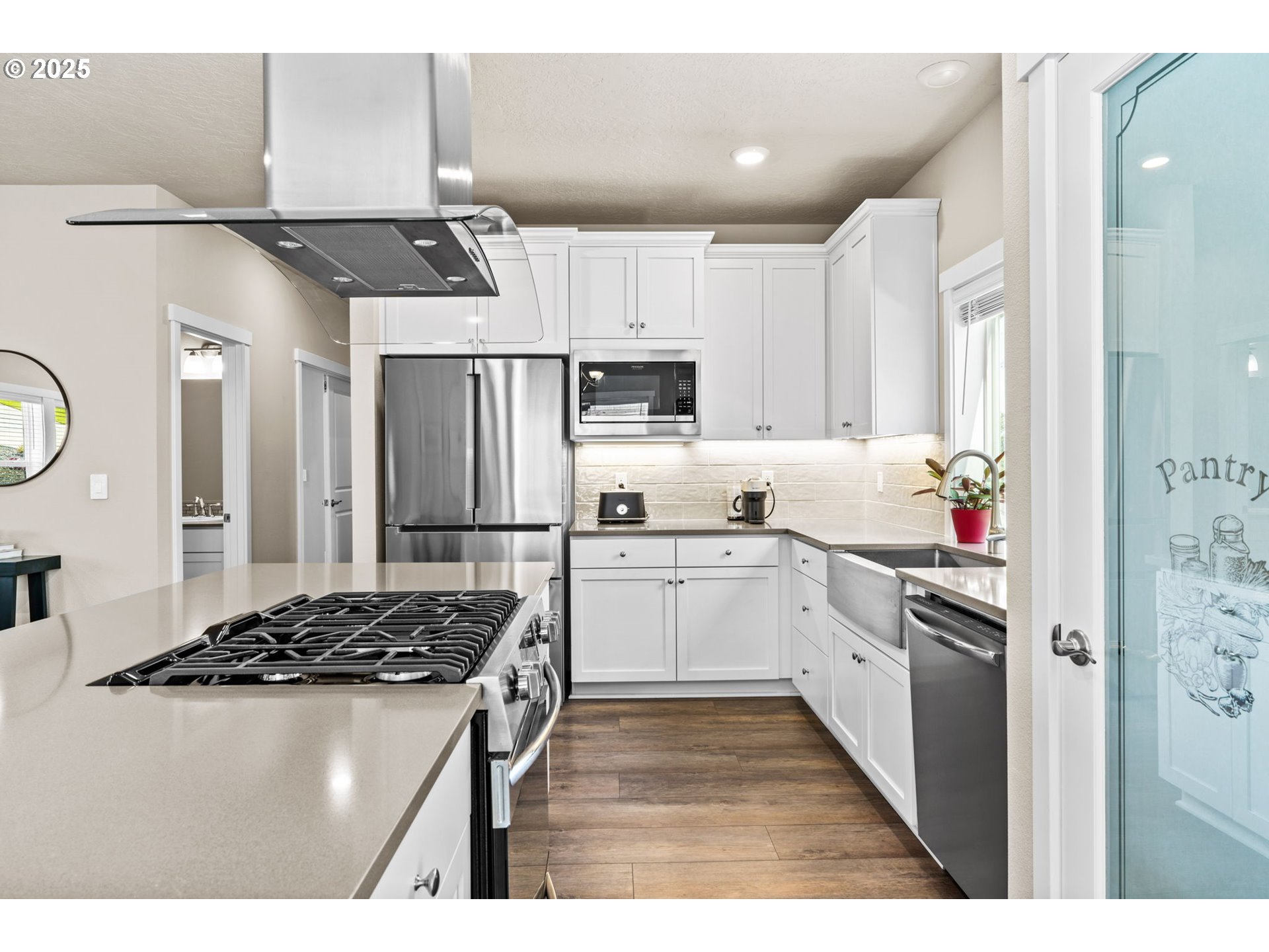 3740 Rockcress Road Eugene, OR 97403 - Photo 15 of 47 a kitchen with a sink stove and cabinets