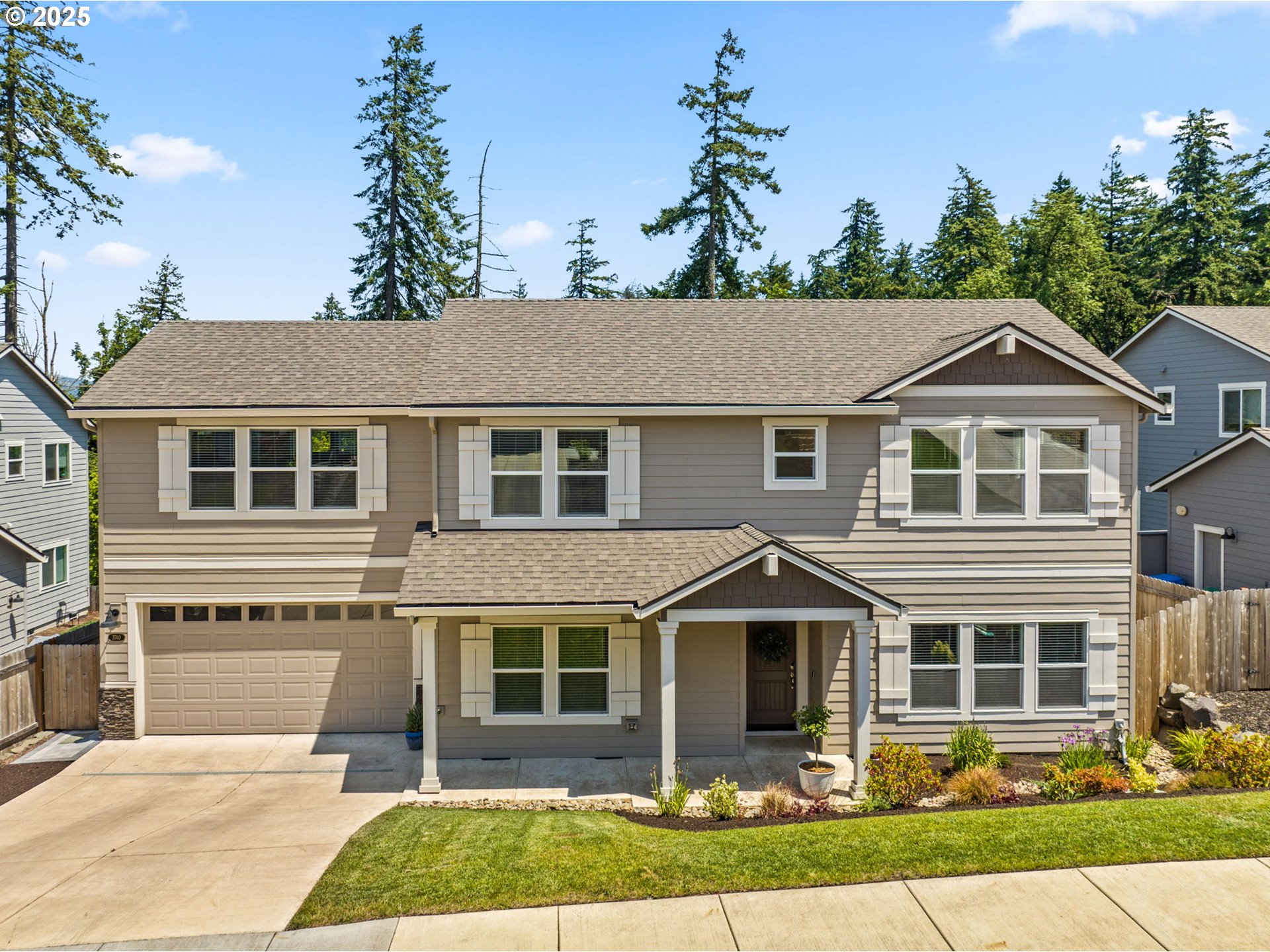 3740 Rockcress Road Eugene, OR 97403 - Photo 2 of 47 a front view of a house with a yard