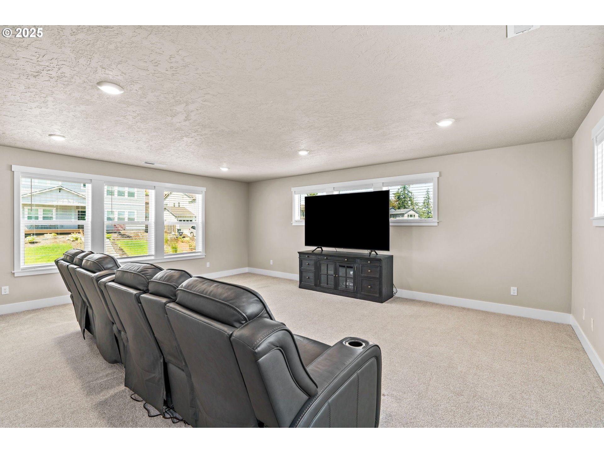3740 Rockcress Road Eugene, OR 97403 - Photo 24 of 47 a living room with furniture and a flat screen tv