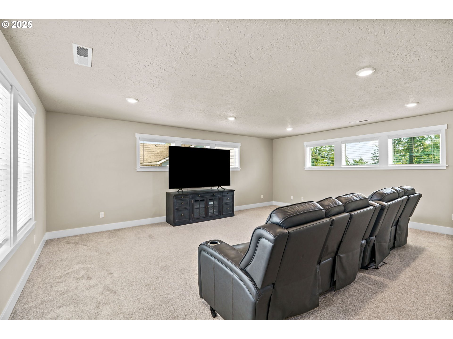 3740 Rockcress Road Eugene, OR 97403 - Photo 27 of 47 a living room with furniture and a flat screen tv