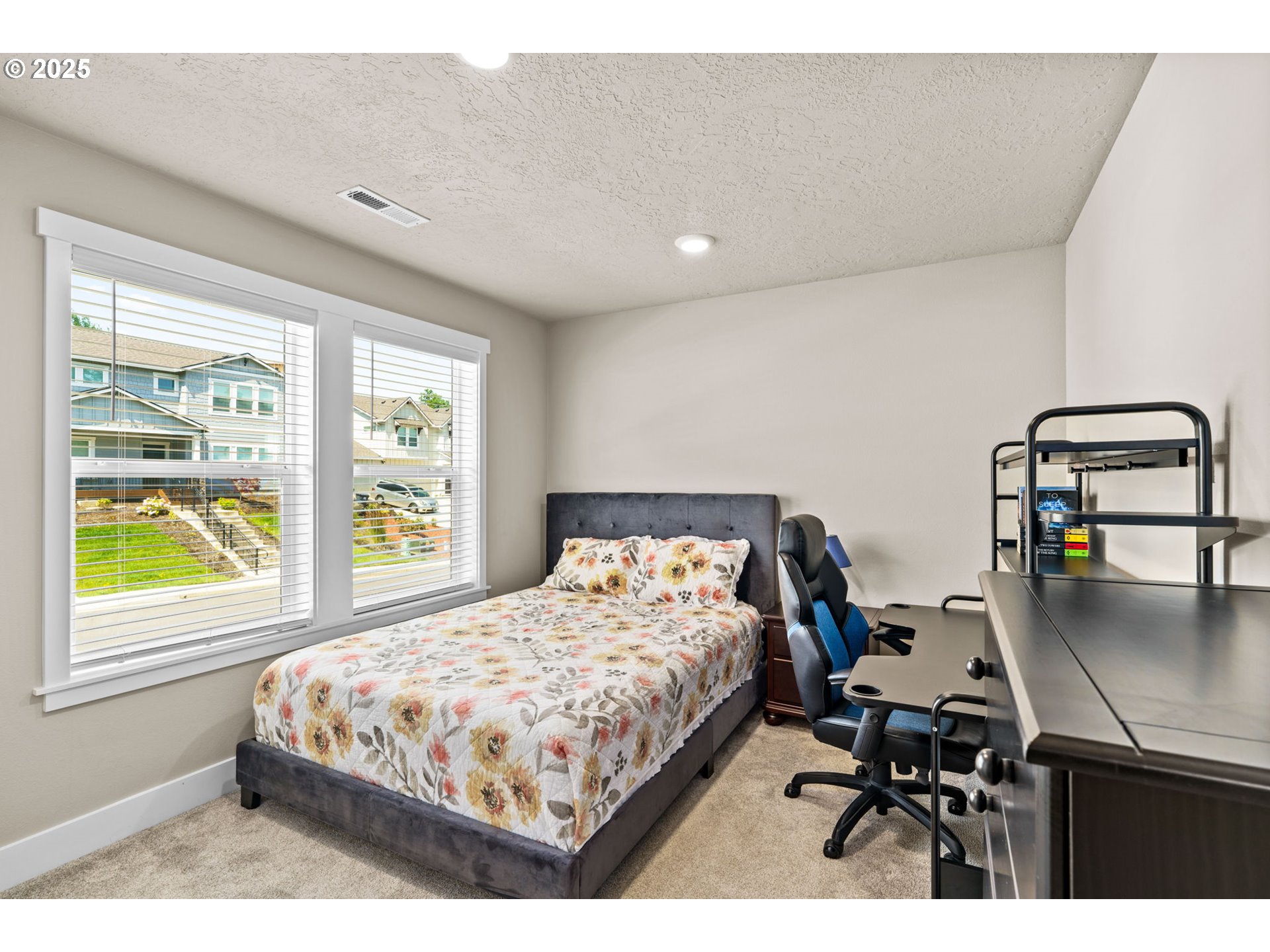3740 Rockcress Road Eugene, OR 97403 - Photo 28 of 47 a bedroom with a bed a table and window