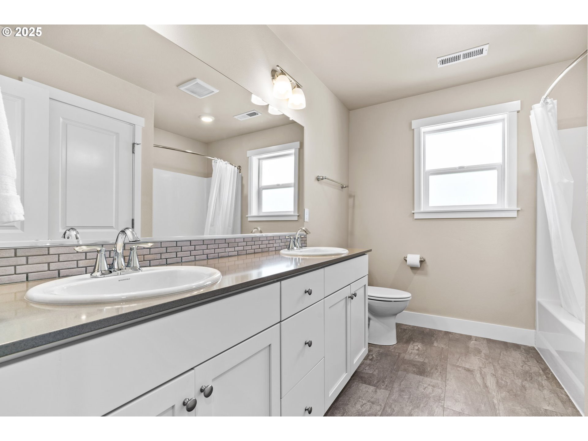 3740 Rockcress Road Eugene, OR 97403 - Photo 30 of 47 a bathroom with a granite countertop sink mirror and a toilet