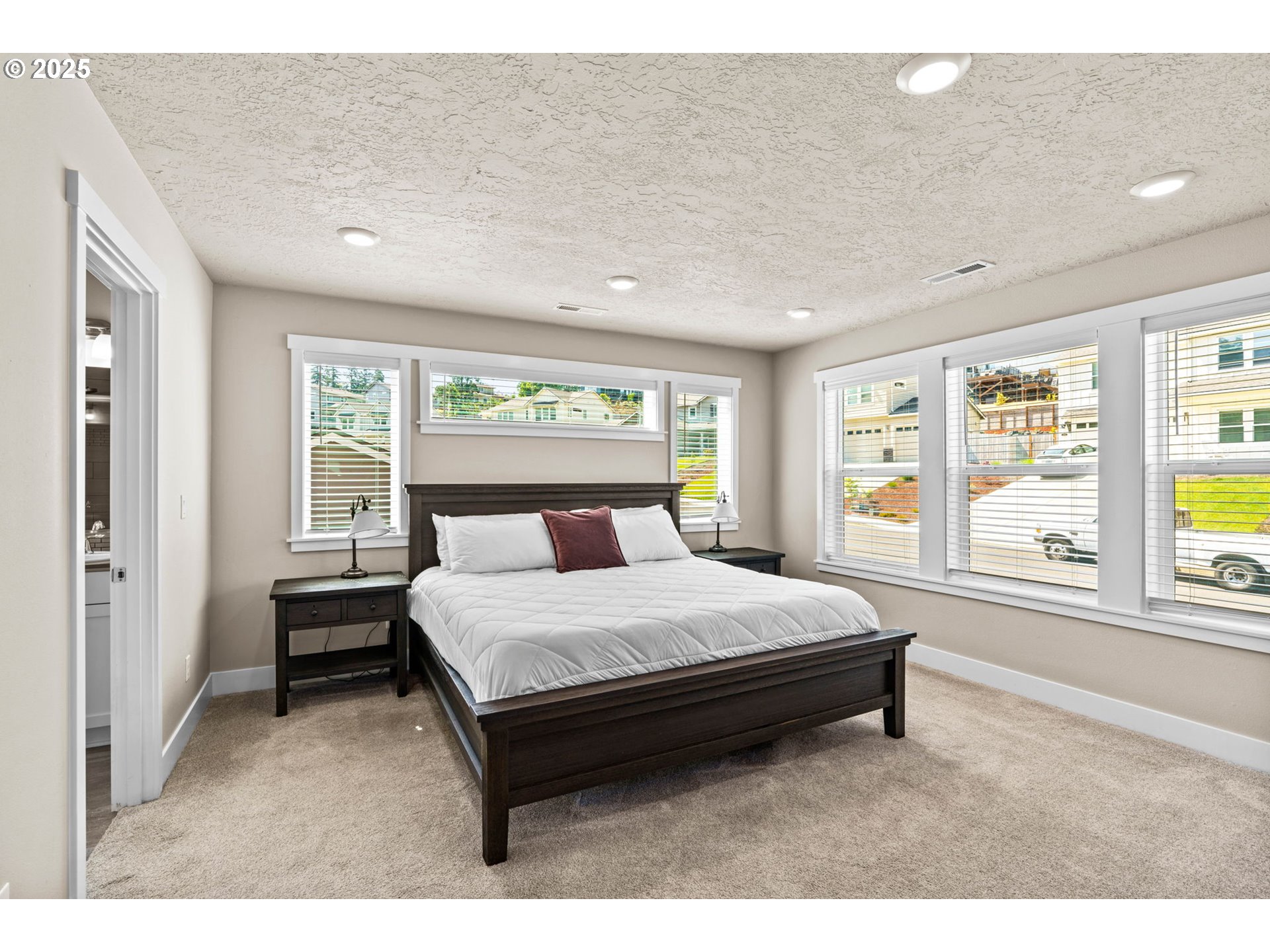 3740 Rockcress Road Eugene, OR 97403 - Photo 33 of 47 a bed sitting in a spacious bedroom next to a window