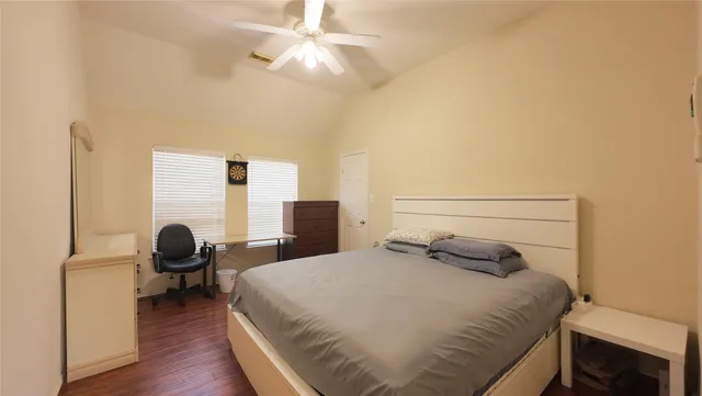 a bedroom with a bed and window