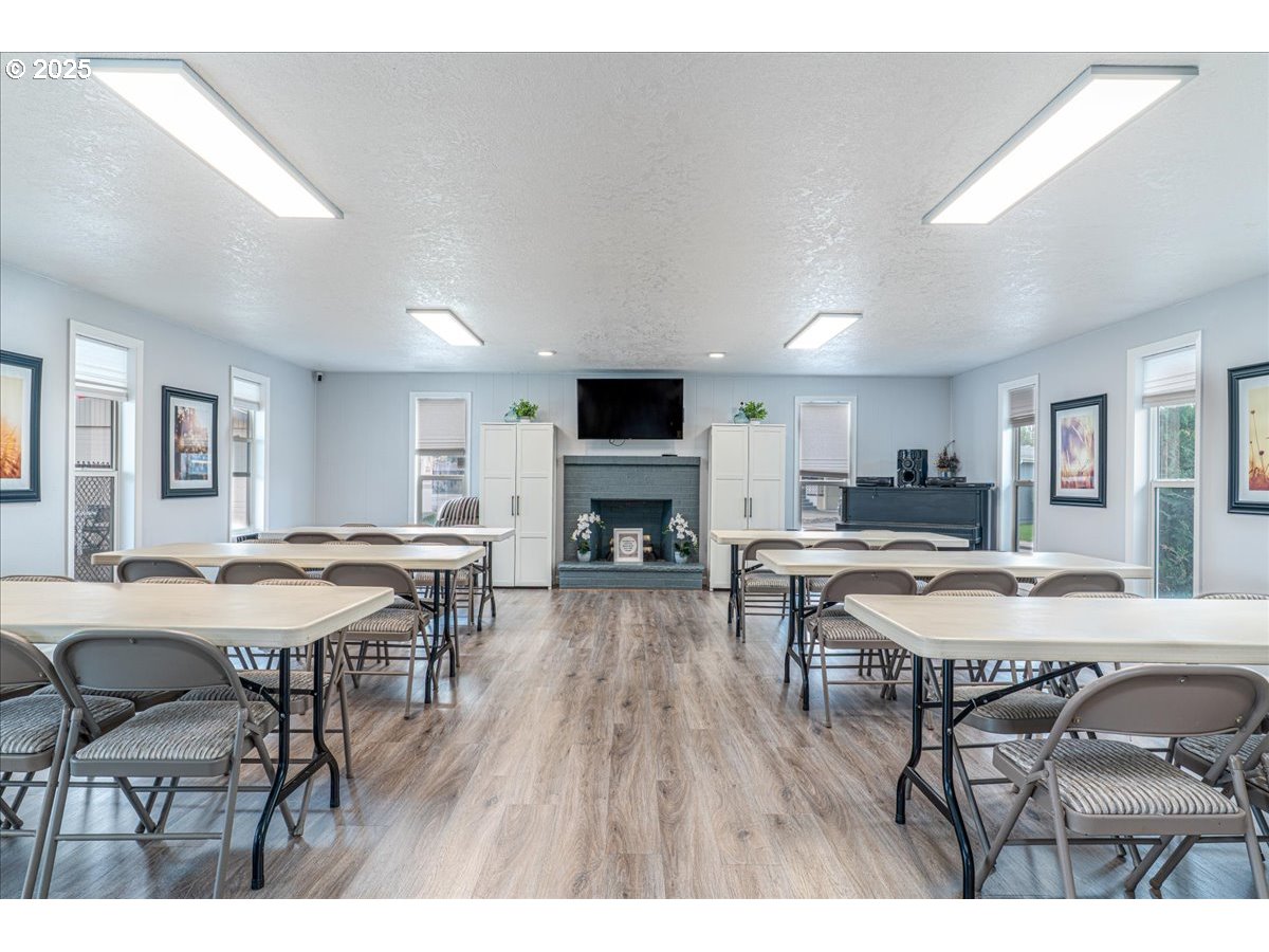 5510 Windsor Island Road North, Unit 19 Keizer, OR 97303 - Photo 28 of 32 a view of a dining room with furniture and a wooden floor