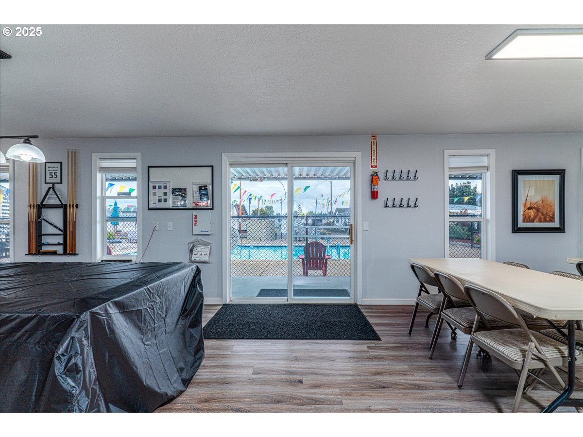 5510 Windsor Island Road North, Unit 19 Keizer, OR 97303 - Photo 30 of 32 a living room with furniture and a wooden floor