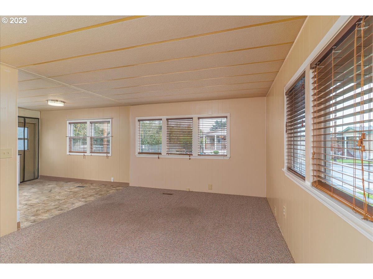5510 Windsor Island Road North, Unit 19 Keizer, OR 97303 - Photo 7 of 32 a view of an empty room with a window