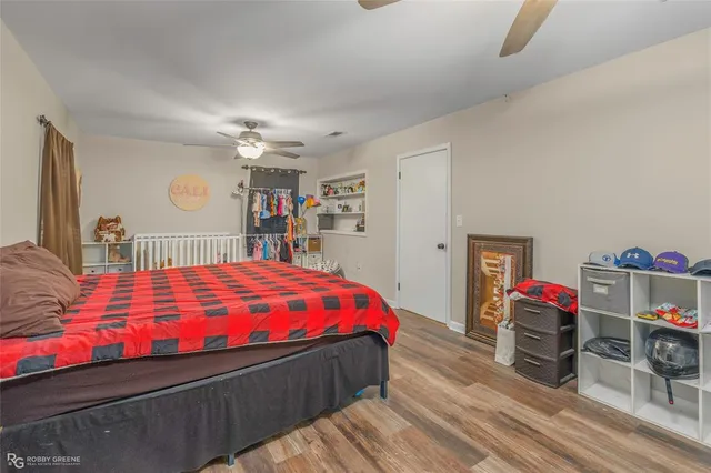 a bedroom with a bed and a large closet