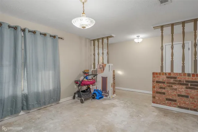 an empty room with a empty space and a window