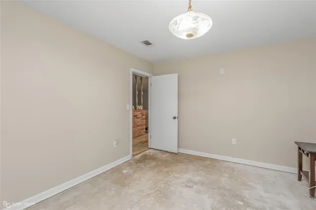 a storage room with wooden floor washer and dryer