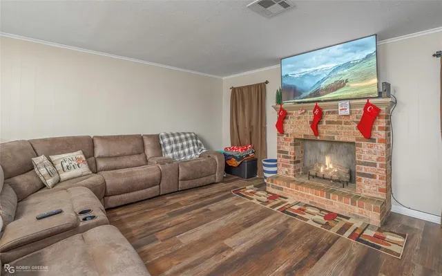 a living room with furniture a couch and a fireplace