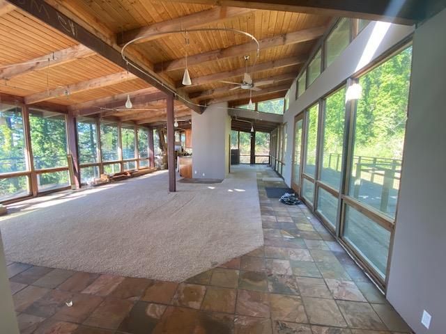 a view of a hall with wooden floor