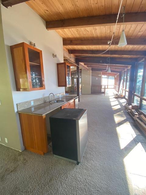 47 Forest View Road Woodside, CA 94062 - Photo 8 of 11 a kitchen with stainless steel appliances kitchen island granite countertop a sink and a refrigerator