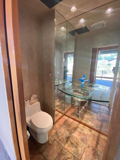 47 Forest View Road Woodside, CA 94062 - Photo 9 of 11 a bathroom with a toilet a sink and a mirror