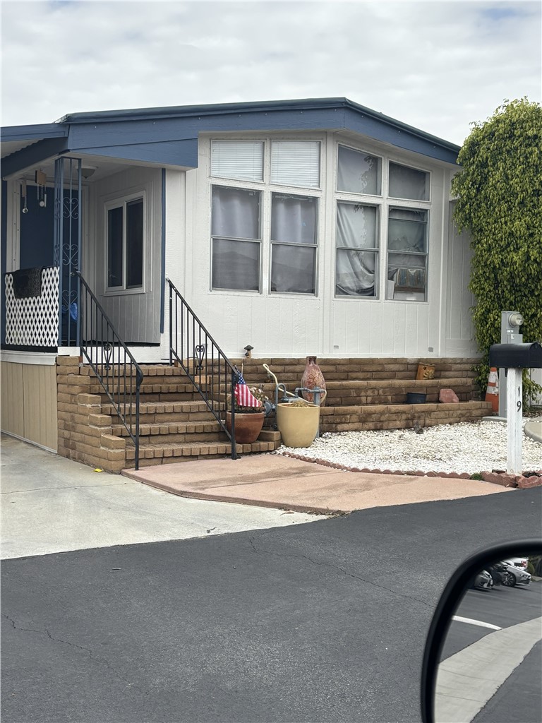 a view of a house with a sink and wooden floor