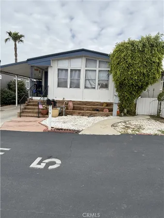 a view of the house with a swimming pool