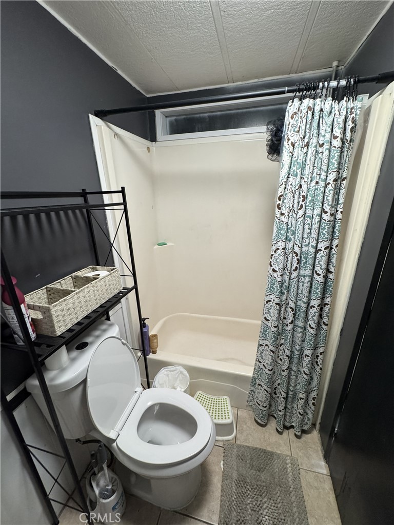1414 West Central Avenue, Unit 19 Brea, CA 92821 - Photo 8 of 9 a bathroom with a sink toilet and shower