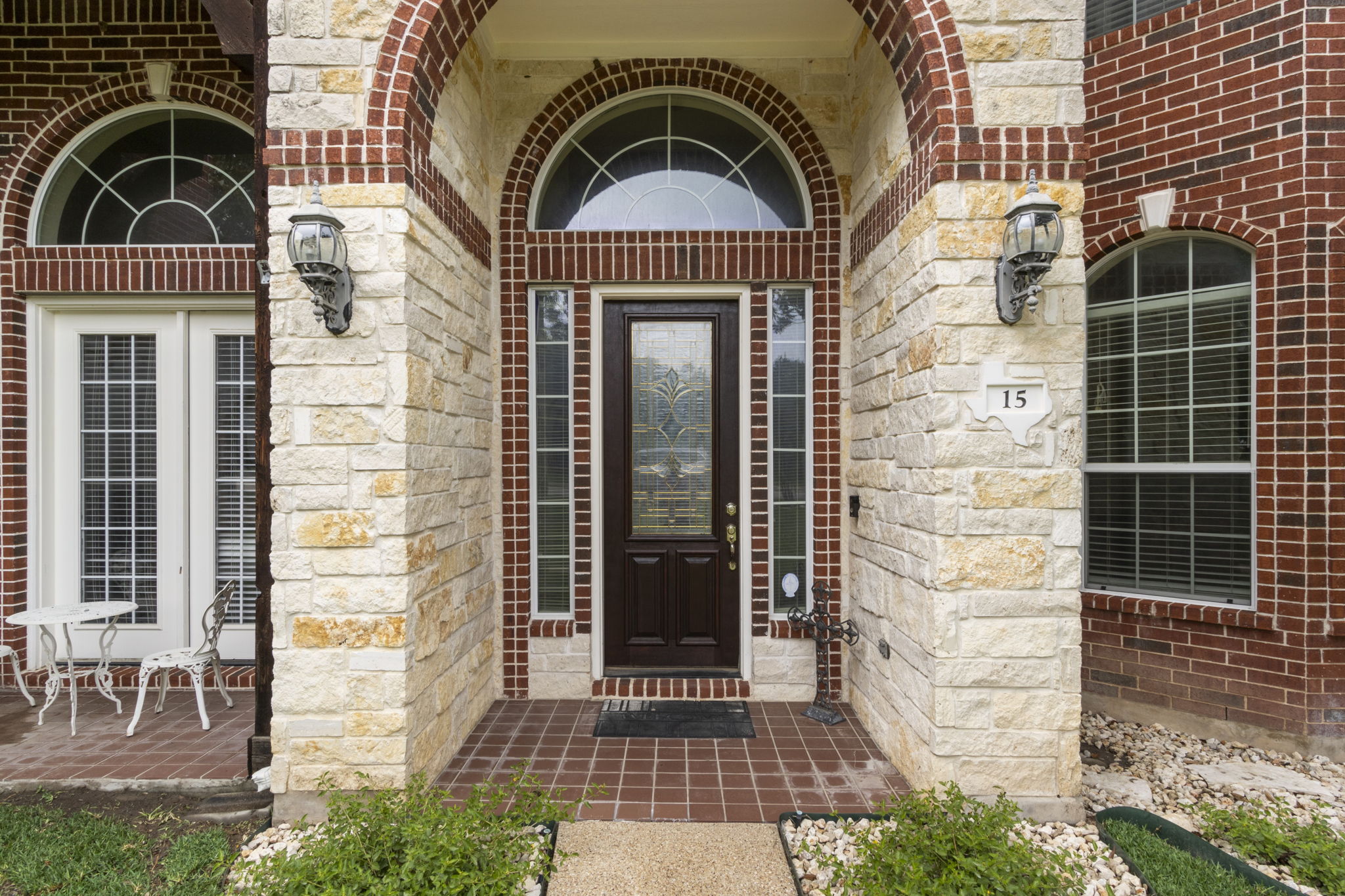 15 Sarazen Loop North Georgetown, TX 78628 - Photo 1 of 40 Doorway to property with brick siding and stone siding