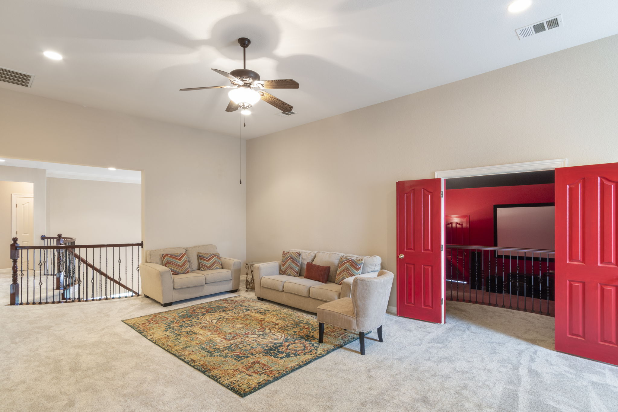 15 Sarazen Loop North Georgetown, TX 78628 - Photo 27 of 40 Carpeted living area featuring ceiling fan and recessed lighting
